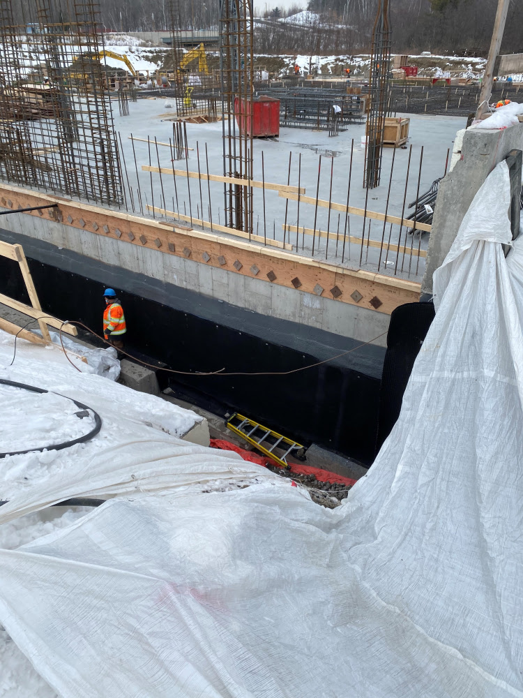 imperméabilisation membrane polyurea projet commercial Québec HIZO